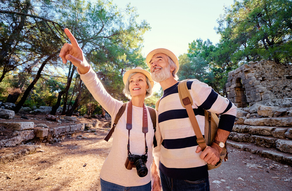 Happy couple in their 60's, touring a historic site, after receiving compounded medication to help with pain management from Health First Pharmacy in Windsor, CA.